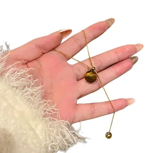 Elegant gold plated tiger eye stone necklace with minimalist round brown pendant