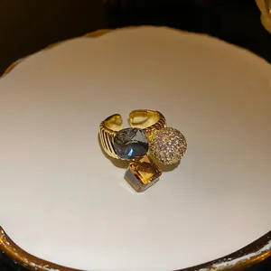 Elegant gold-plated open ring featuring geometric zircon and a sparkling crystal sphere.