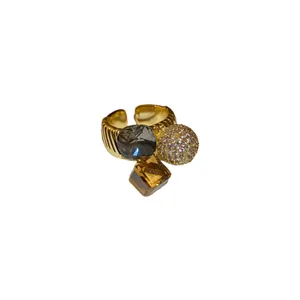 Elegant gold-plated geometric open ring featuring sparkling CZ stones and amber crystal accents