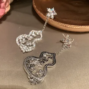 Detailed view of zircon flower gourd tassel earrings showing front and back metalwork.