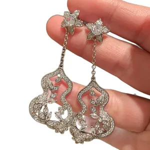 Elegant silver gourd tassel earrings with zircon flower studs and hollow design
