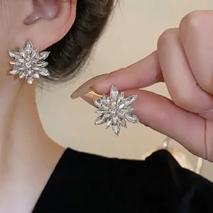 Sparkling silver needle flower stud earrings with brilliant marquise-cut crystals