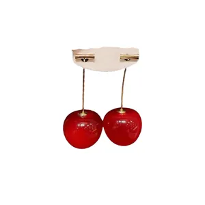 Sweet red cherry drop earrings for women featuring a glossy finish and elegant gold-tone stems