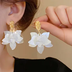 Elegant white floral drop earrings with gold hammered metal studs, stylish jewelry for women
