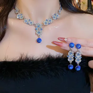Detailed view of elegant royal blue crystal flower necklace and matching drop earrings