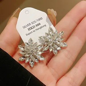 Detail shot of elegant sparkling crystal flower stud earrings with 925 silver needles