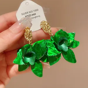 Vibrant green flower drop earrings with gold-textured studs and silver needles