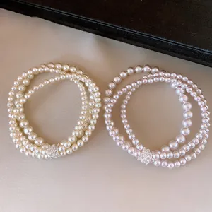 Elegant multi-strand pearl bracelets with sparkling zircon encrusted cylinder beads