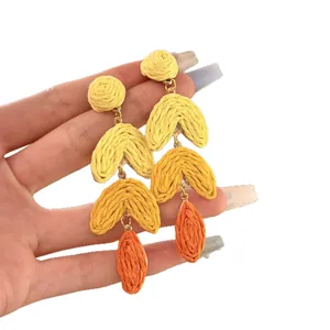 Handmade raffia leaf drop earrings with yellow and orange gradient design