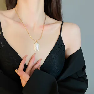 Elegant real gold plated necklace featuring a large oval white pearl pendant charm