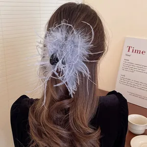Detailed close-up of an elegant lavender feather hair claw clip worn on long styled hair
