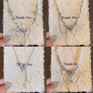 Collana con Pendente a Farfalla Stile Dolce e Cool in Acciaio al Titanio con Strass e Perla Artificiale Gioielli da Donna