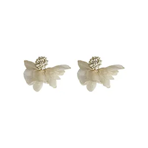 Elegant cream organza petal stud earrings with central pearl-like bead cluster detail