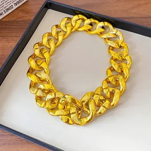Statement chunky gold-tone acrylic chain necklace featuring a high-shine metallic finish