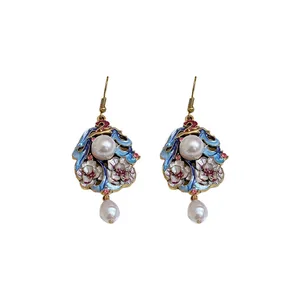 Elegant vintage palace style enamel floral earrings with dangling pearl drops on white background