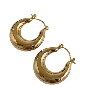 Minimalist gold plated chunky hoop earrings with an elegant high-polished finish.