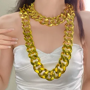 High-quality close-up of an oversized gold acrylic chunky chain necklace on a female model