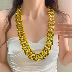 Close-up of a chunky gold acrylic chain necklace in punk style worn by a model