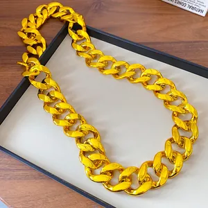 Detailed view of the lustrous gold acrylic chunky links on a punk style necklace