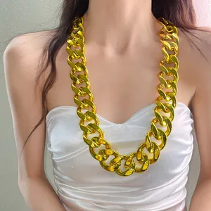 Oversized chunky gold acrylic chain necklace displayed as a statement piece on model