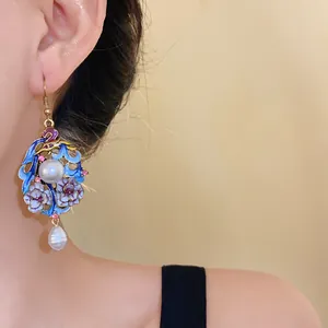 Exquisite vintage ethnic floral enamel drop earrings with white pearls on model's ear