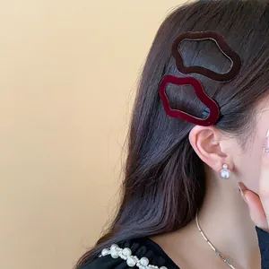 Elegant flocked irregular wavy hair clips for women in autumn winter style.