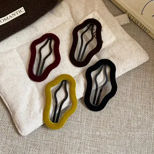 Stylish irregular flocked geometric hair clips in autumn velvet colors for daily wear.