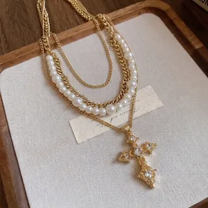 Vintage French style multi-layer necklace with pearls and ornate diamond cross pendant
