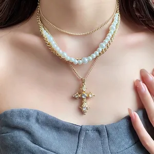 Retro French style multi-layer pearl necklace with a crystal-encrusted cross pendant