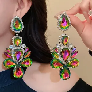 Detailed shot of oversized colorful crystal dangle earrings with rhinestones