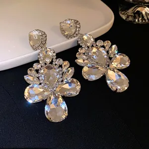 Close-up of elegant teardrop rhinestone chandelier earrings with sparkling crystals
