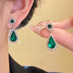 Elegant vintage emerald green waterdrop earrings with shimmering halo crystal flower studs