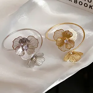 Elegant hollow floral open bangles with sparkling crystal centers in gold and silver finish