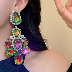 Macro view of colorful iridescent gemstones and rhinestones on luxury drop earrings