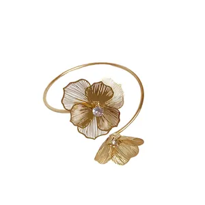 Elegant gold floral open bangle bracelet with sparkling crystal rhinestones for women.