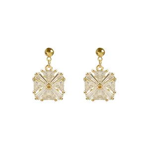 Elegant gold-toned geometric stud earrings with sparkling clear cubic zirconia stones