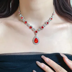 Close-up of vintage water-drop red gemstone necklace with floral rhinestone detailing