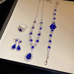 Exquisite vintage 4-piece jewelry set with blue waterdrop stones and rhinestones