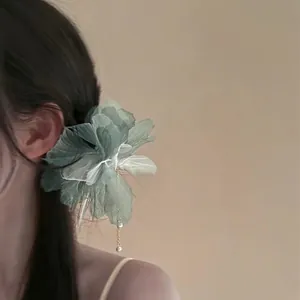 Elegant green fabric flower hairpin with hanging pearl charms for a fairy-like look.