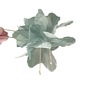 Elegant sage green fabric flower hair pin with pearl tassels for a classic aesthetic.