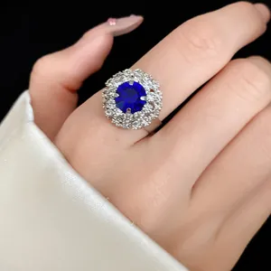 Close-up of a vintage royal palace style sapphire-style flower ring with sparkling diamonds