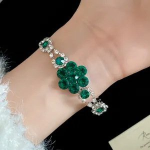 Vintage emerald green crystal flower bracelet with sparkling silver rhinestone accents