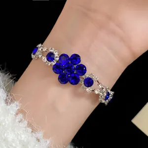 Elegant blue crystal flower bracelet with silver setting shown in detailed macro view