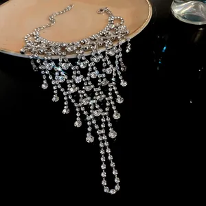 Detailed macro shot of sparkling multi-layered rhinestone tassel bracelet on dark background