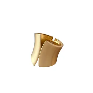 Elegant wide asymmetrical open cuff bracelet with matte gold brushed finish for women