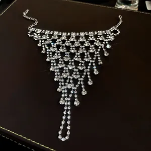 Detailed view of luxury sparkling multi-layer rhinestone tassel hand harness for women