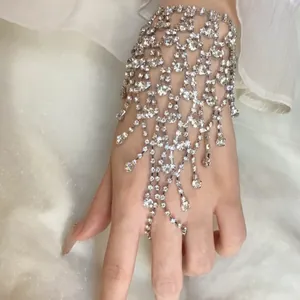 Exquisite rhinestone mesh hand harness with cascading fringe detail