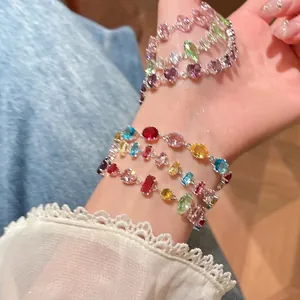 Detailed macro view of multi-colored zircon bracelets featuring various gem shapes and colors
