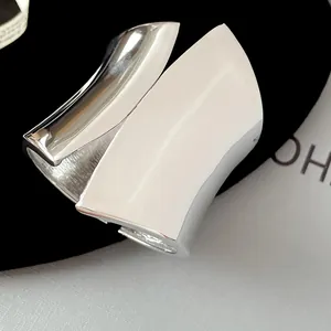 Close-up macro view of high-polished silver finish on asymmetric wide open cuff bracelet