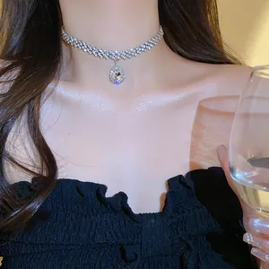 Elegant waterdrop zircon choker necklace with sparkling rhinestone chain on model
